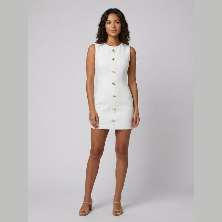 Ronda white sleeveless mini dress with gold buttons, on model